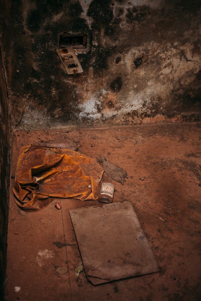 Warm roof light and worn plaster fill an abandoned room in Goa. print option