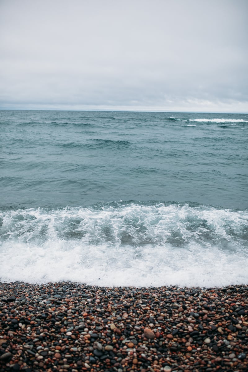 Soft surf rolls onto a pebble beach on Lake Huron. print option