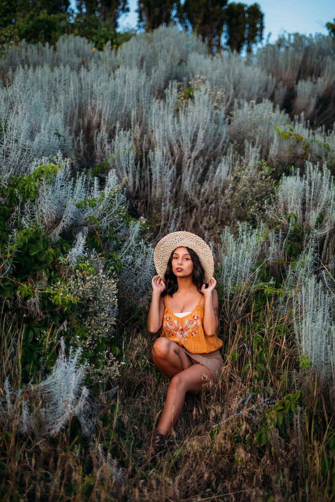 Angelica in Garden Light story frame 18: Mirror play, garden colour, straw hat and reflective frames with a quieter kind of romance.