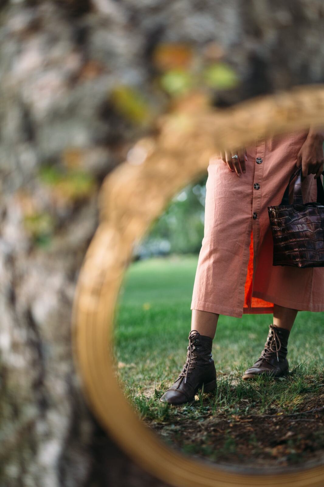 Angelica in Garden Light story frame 4: Mirror play, garden colour, straw hat and reflective frames with a quieter kind of romance.