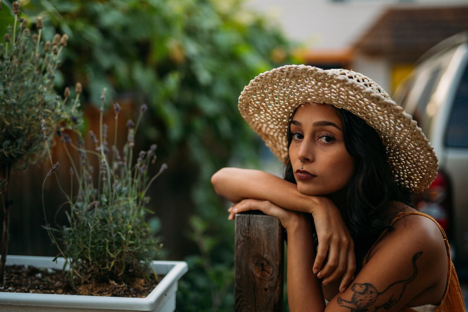 Angelica in Garden Light story frame 12: Mirror play, garden colour, straw hat and reflective frames with a quieter kind of romance.