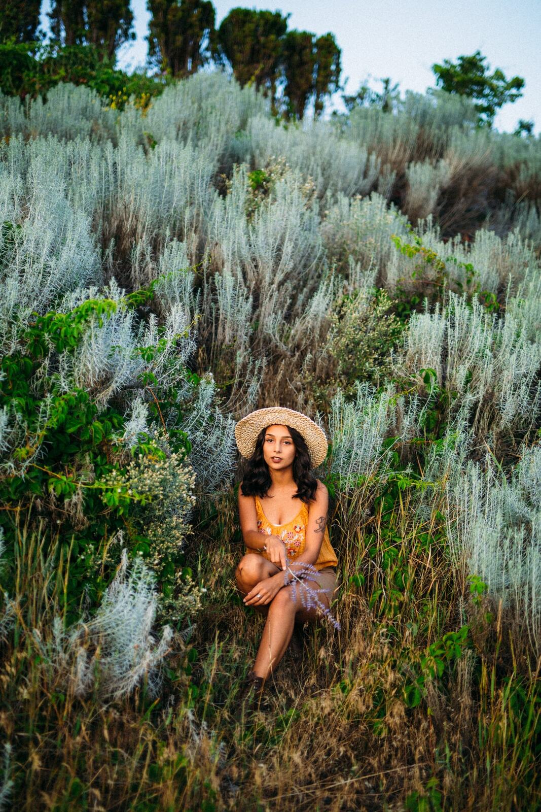 Angelica in Garden Light story frame 17: Mirror play, garden colour, straw hat and reflective frames with a quieter kind of romance.