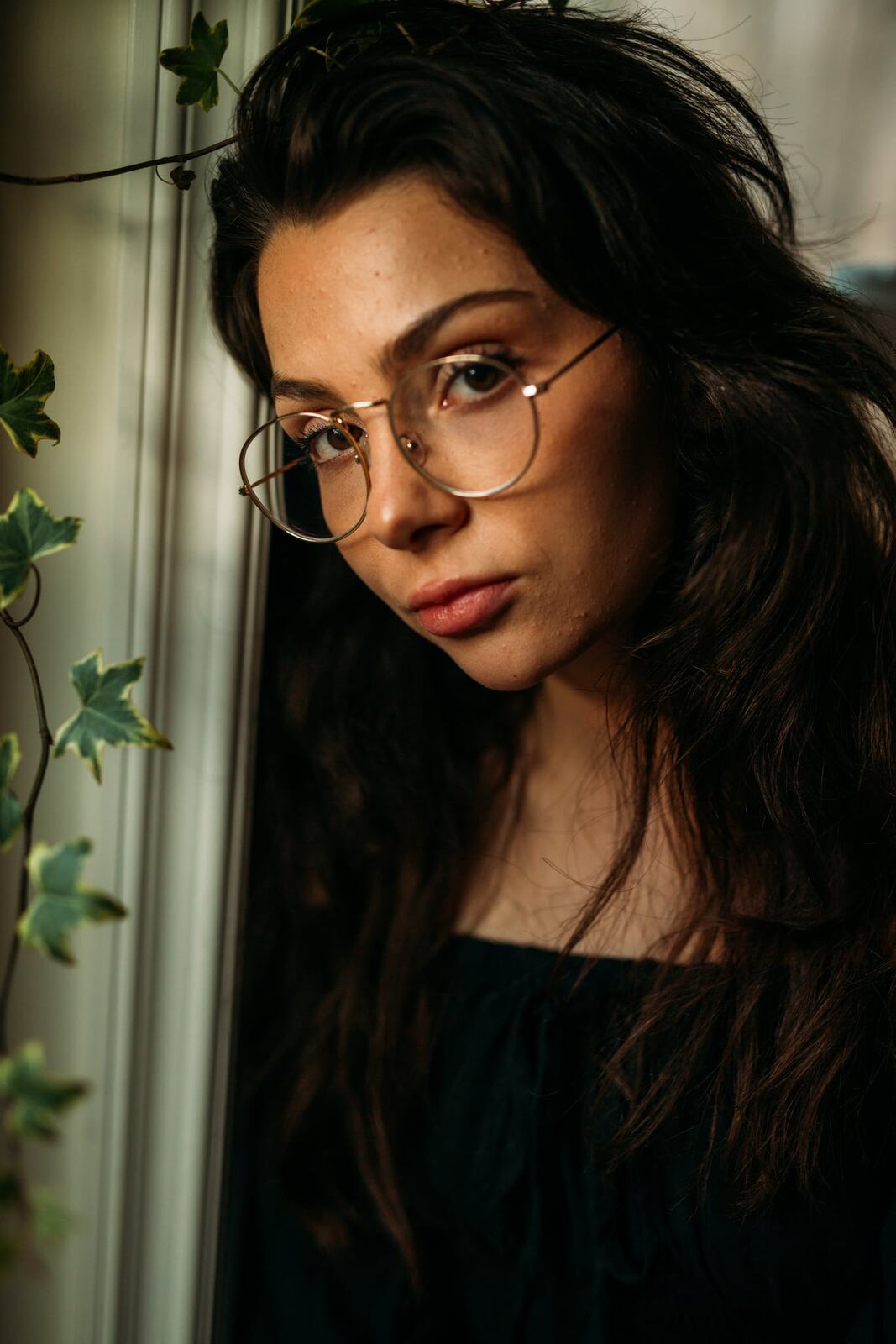Mel in Reeds and Warm Dusk story frame 13: Bubbles, lake edge, reeds, glasses and dusk colour from a playful portrait story.