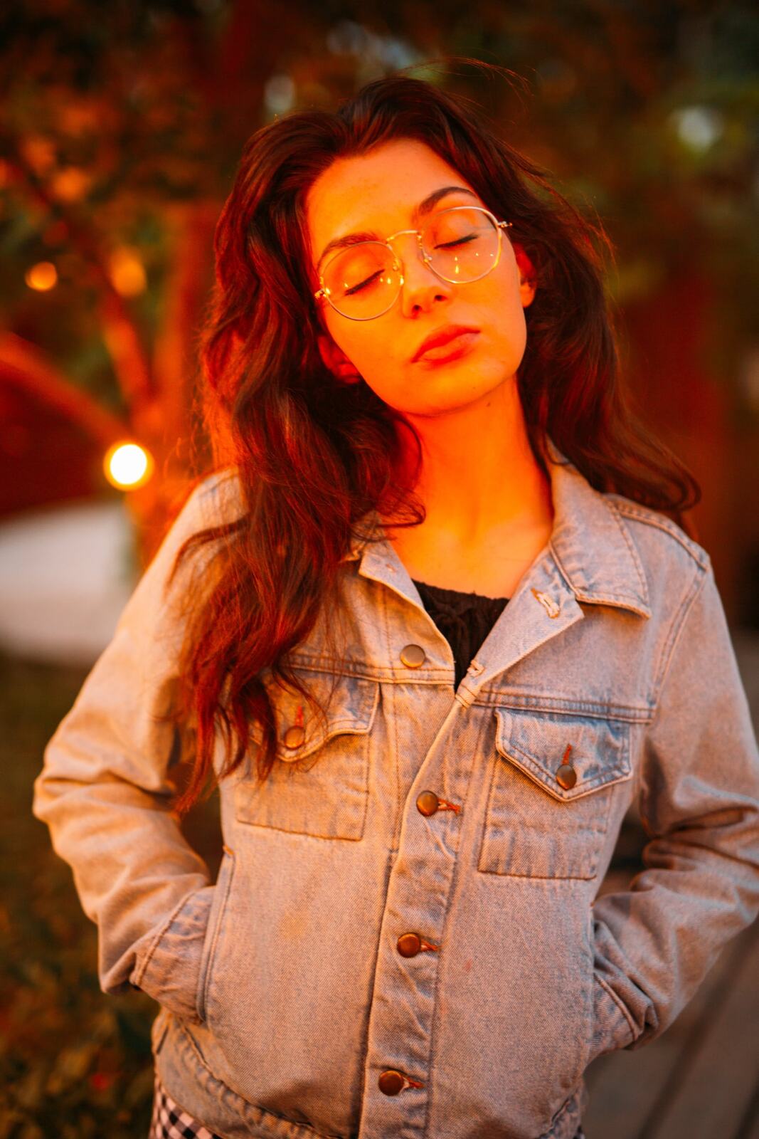 Mel in Reeds and Warm Dusk story frame 18: Bubbles, lake edge, reeds, glasses and dusk colour from a playful portrait story.