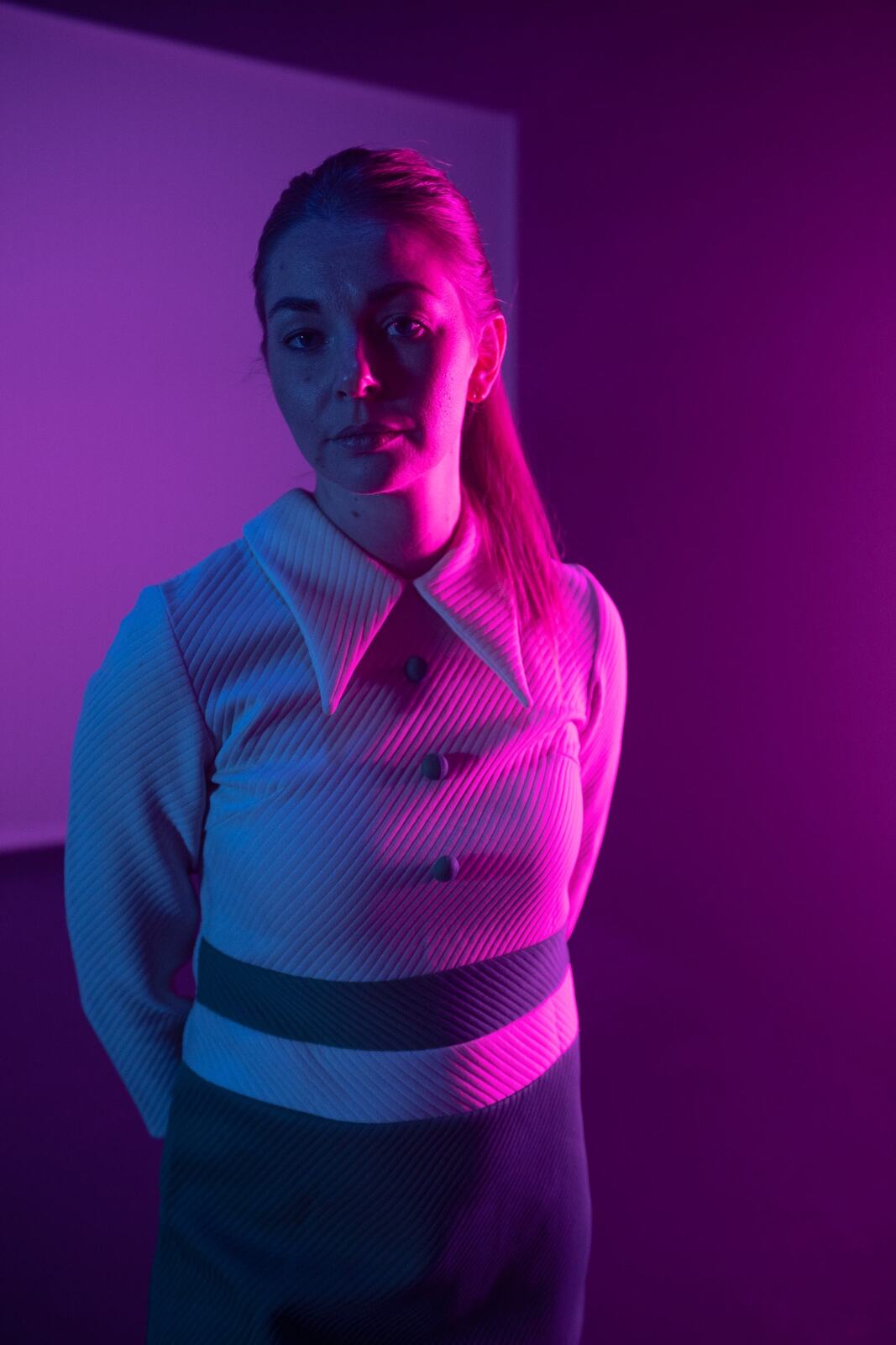 Angela in Colour portraits story frame 29: Angela in a colourful studio portrait set with clean expression, styled wardrobe, controlled light and a polished creative-portrait feel.