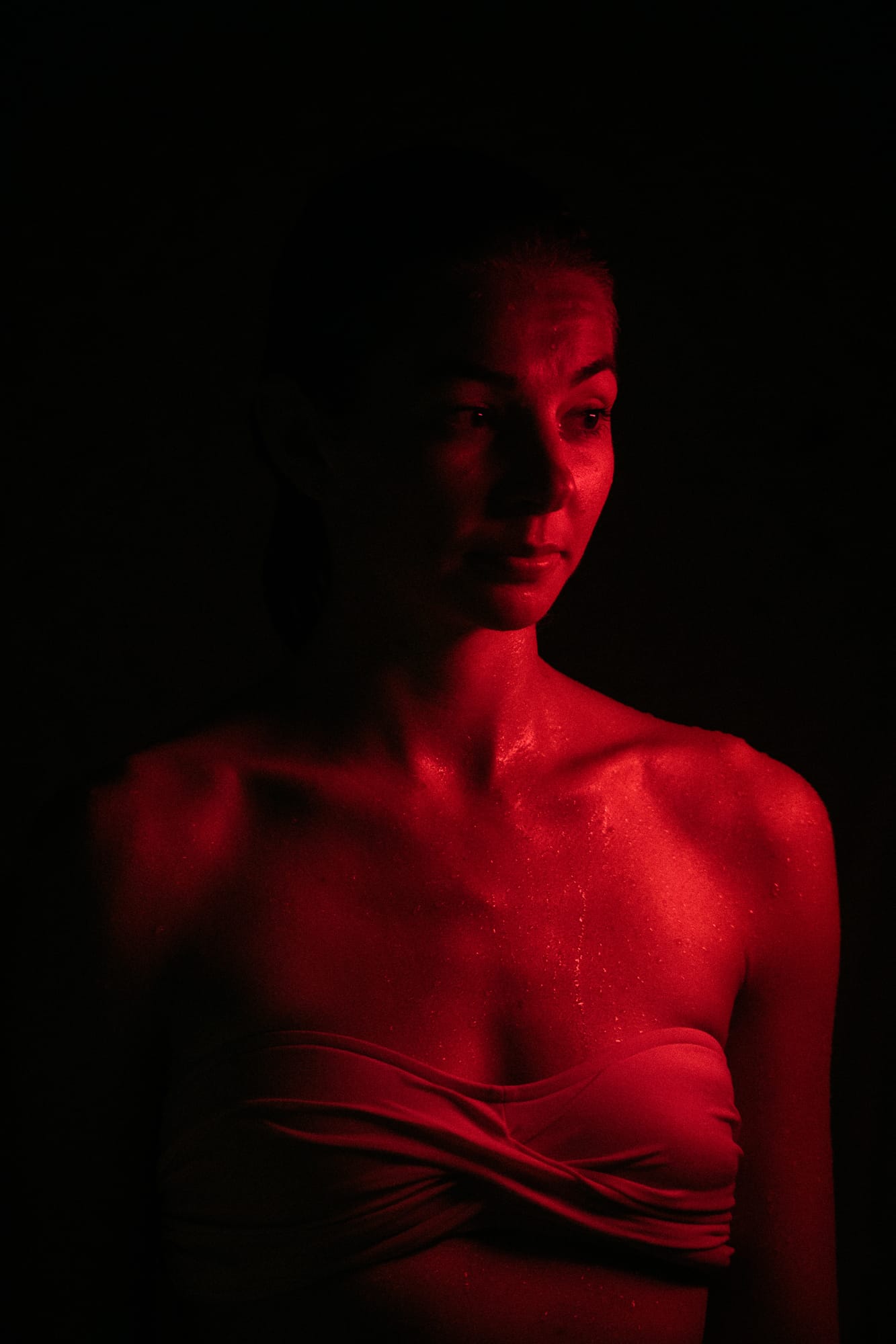 Angela at Float Space portraits story frame 3: A Float Space portrait set that moves from clean wellness headshots into red low-key portraits, skin, shadow and close detail.