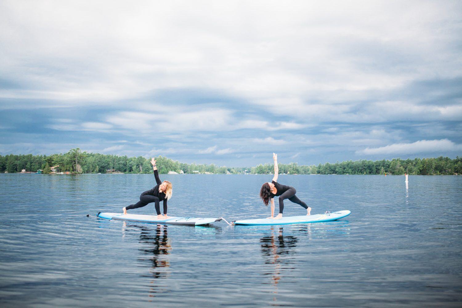Ash and Jill, SUP Yoga corporate story frame 4: Corporate lifestyle photography for Ash and Jill on stand-up paddleboards, with yoga movement, instructor portraits and lake-based imagery for a wellness business.