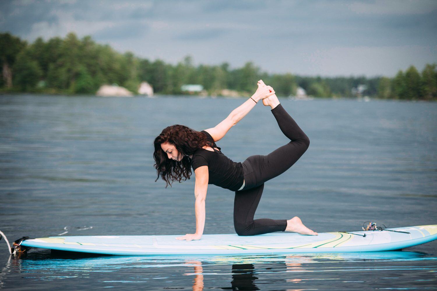Ash and Jill, SUP Yoga corporate story frame 7: Corporate lifestyle photography for Ash and Jill on stand-up paddleboards, with yoga movement, instructor portraits and lake-based imagery for a wellness business.
