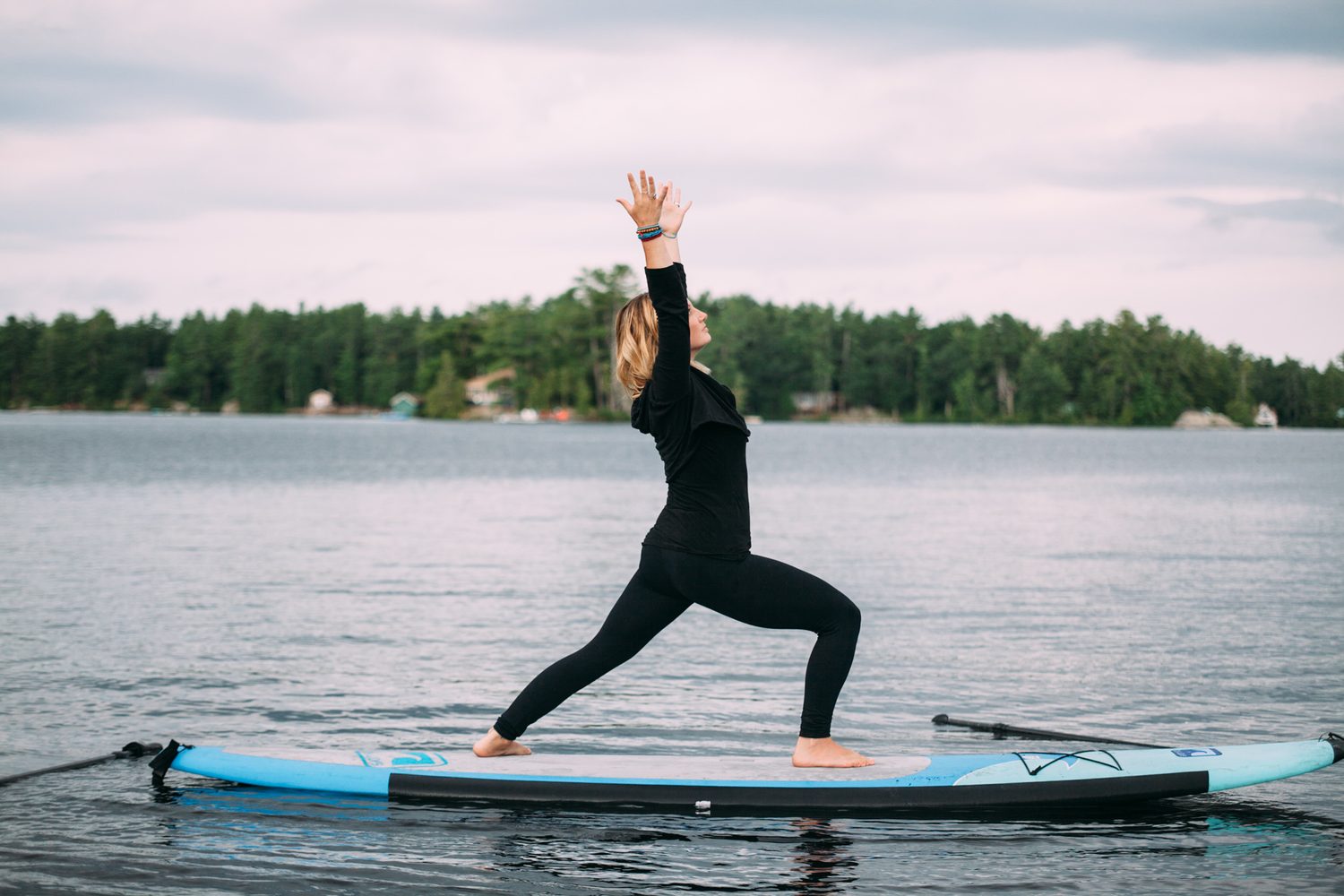 Ash and Jill, SUP Yoga corporate story frame 10: Corporate lifestyle photography for Ash and Jill on stand-up paddleboards, with yoga movement, instructor portraits and lake-based imagery for a wellness business.