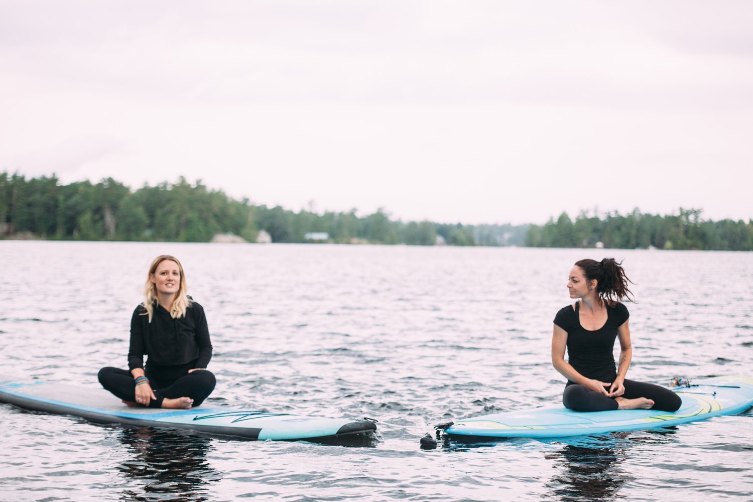 Ash and Jill, SUP Yoga corporate story frame 17: Corporate lifestyle photography for Ash and Jill on stand-up paddleboards, with yoga movement, instructor portraits and lake-based imagery for a wellness business.
