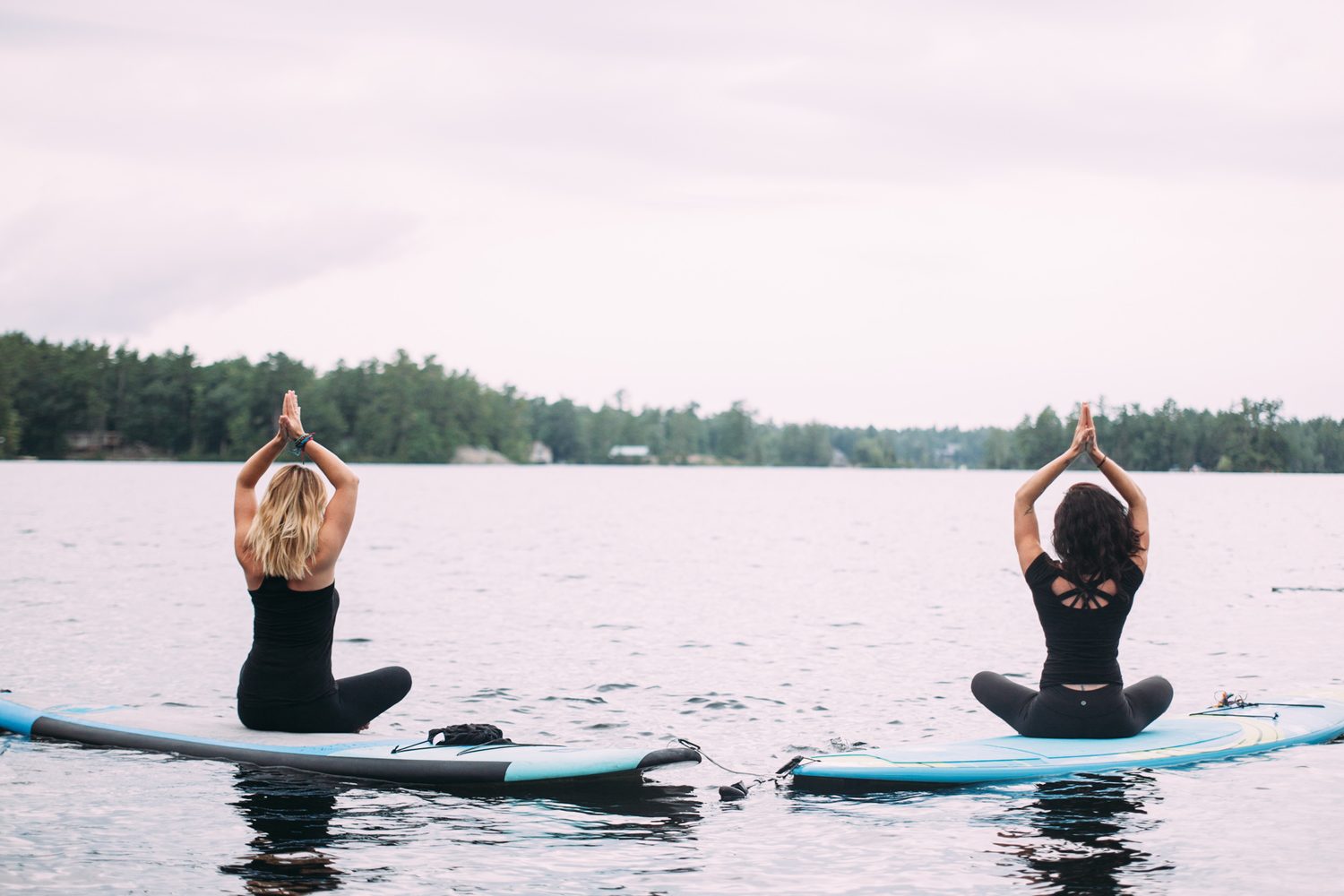 Ash and Jill, SUP Yoga corporate story frame 18: Corporate lifestyle photography for Ash and Jill on stand-up paddleboards, with yoga movement, instructor portraits and lake-based imagery for a wellness business.