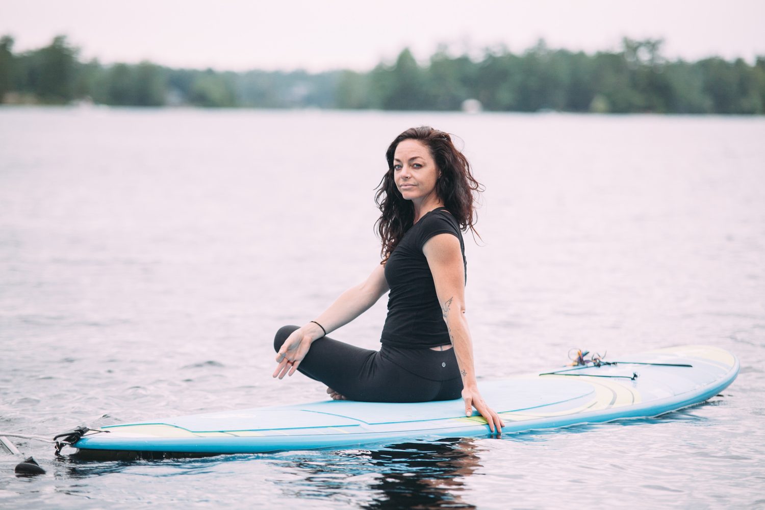 Ash and Jill, SUP Yoga corporate story frame 20: Corporate lifestyle photography for Ash and Jill on stand-up paddleboards, with yoga movement, instructor portraits and lake-based imagery for a wellness business.