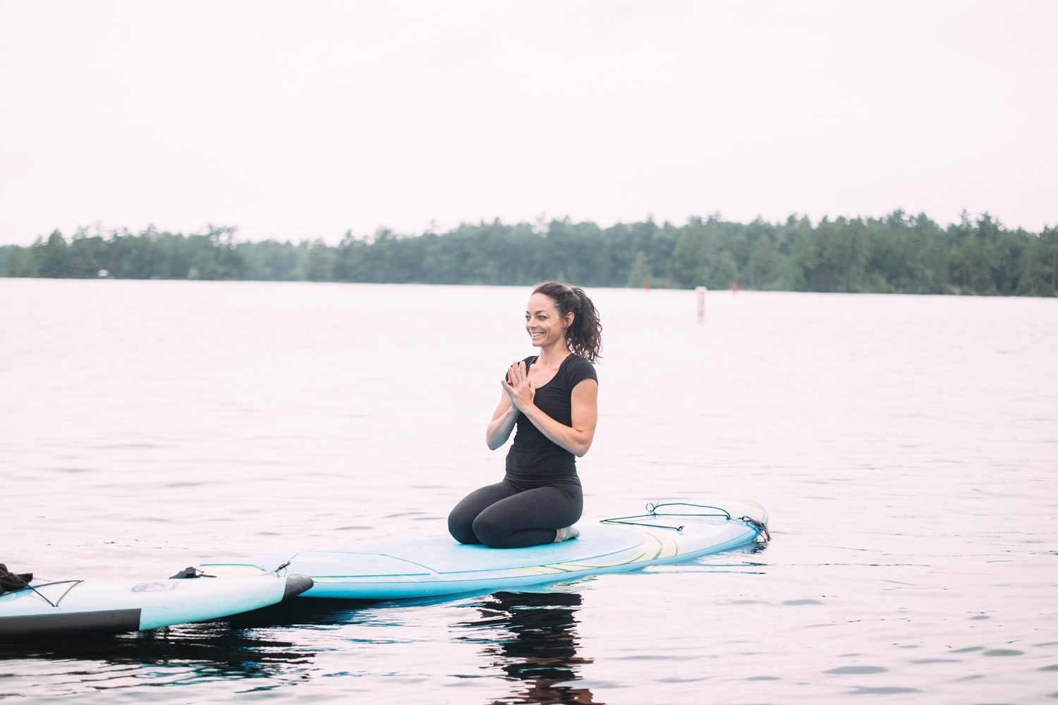 Ash and Jill, SUP Yoga corporate story frame 27: Corporate lifestyle photography for Ash and Jill on stand-up paddleboards, with yoga movement, instructor portraits and lake-based imagery for a wellness business.