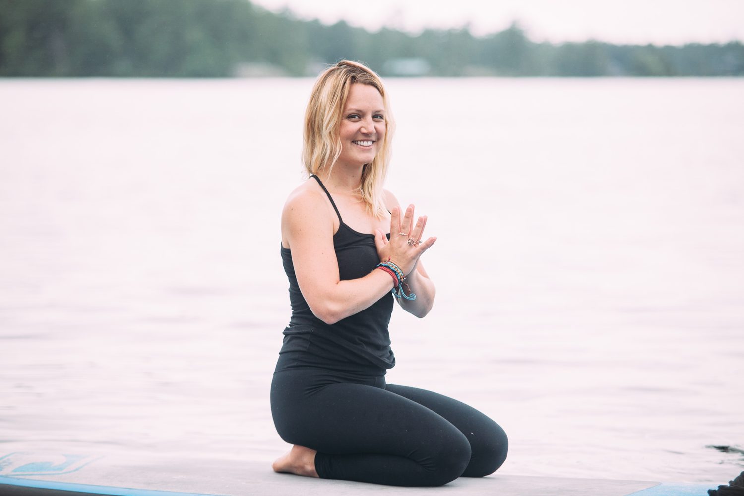 Ash and Jill, SUP Yoga corporate story frame 28: Corporate lifestyle photography for Ash and Jill on stand-up paddleboards, with yoga movement, instructor portraits and lake-based imagery for a wellness business.
