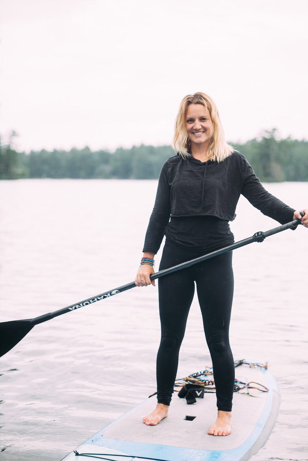 Ash and Jill, SUP Yoga corporate story frame 29: Corporate lifestyle photography for Ash and Jill on stand-up paddleboards, with yoga movement, instructor portraits and lake-based imagery for a wellness business.
