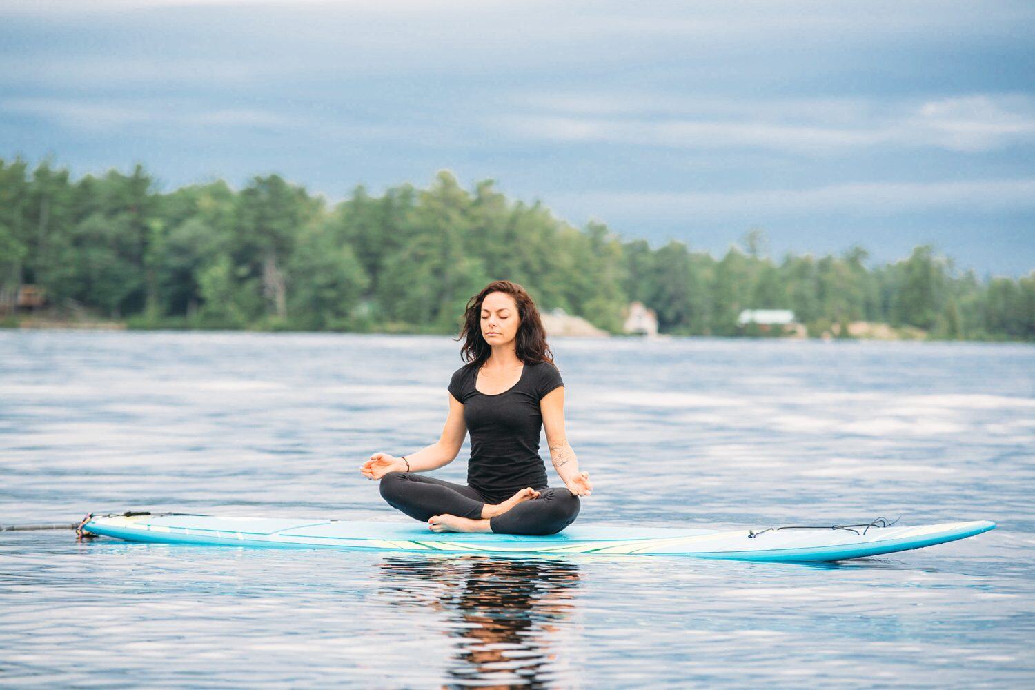 Ash and Jill, SUP Yoga corporate story frame 31: Corporate lifestyle photography for Ash and Jill on stand-up paddleboards, with yoga movement, instructor portraits and lake-based imagery for a wellness business.
