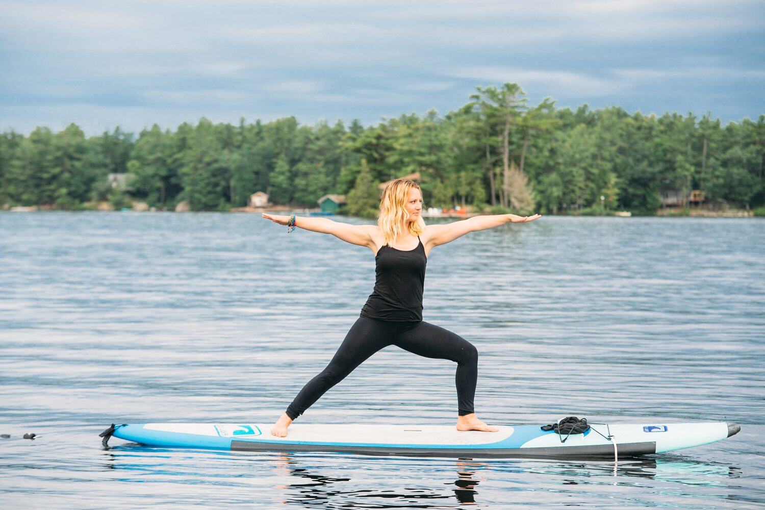 Ash and Jill, SUP Yoga corporate story frame 33: Corporate lifestyle photography for Ash and Jill on stand-up paddleboards, with yoga movement, instructor portraits and lake-based imagery for a wellness business.