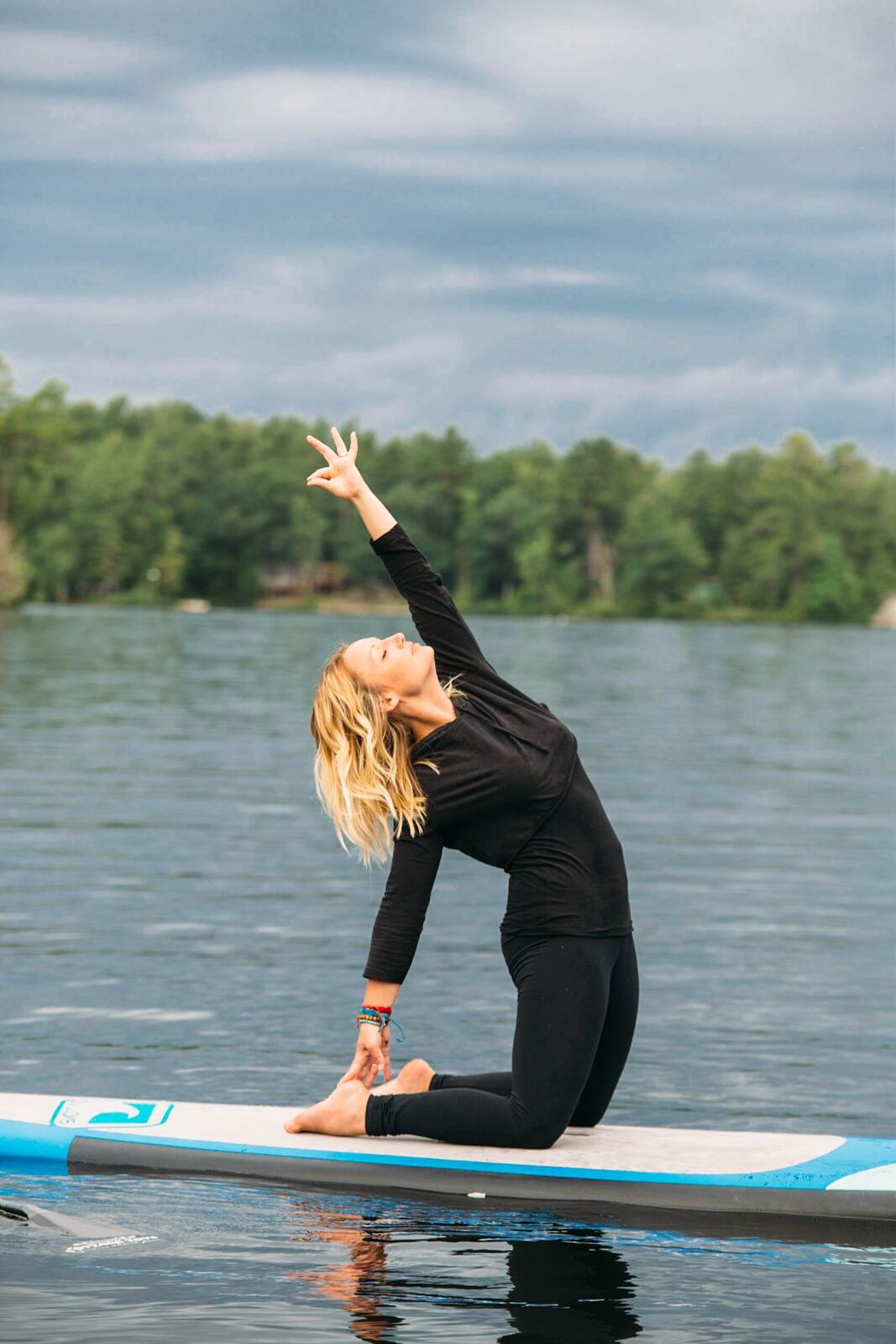 Ash and Jill, SUP Yoga corporate story frame 34: Corporate lifestyle photography for Ash and Jill on stand-up paddleboards, with yoga movement, instructor portraits and lake-based imagery for a wellness business.