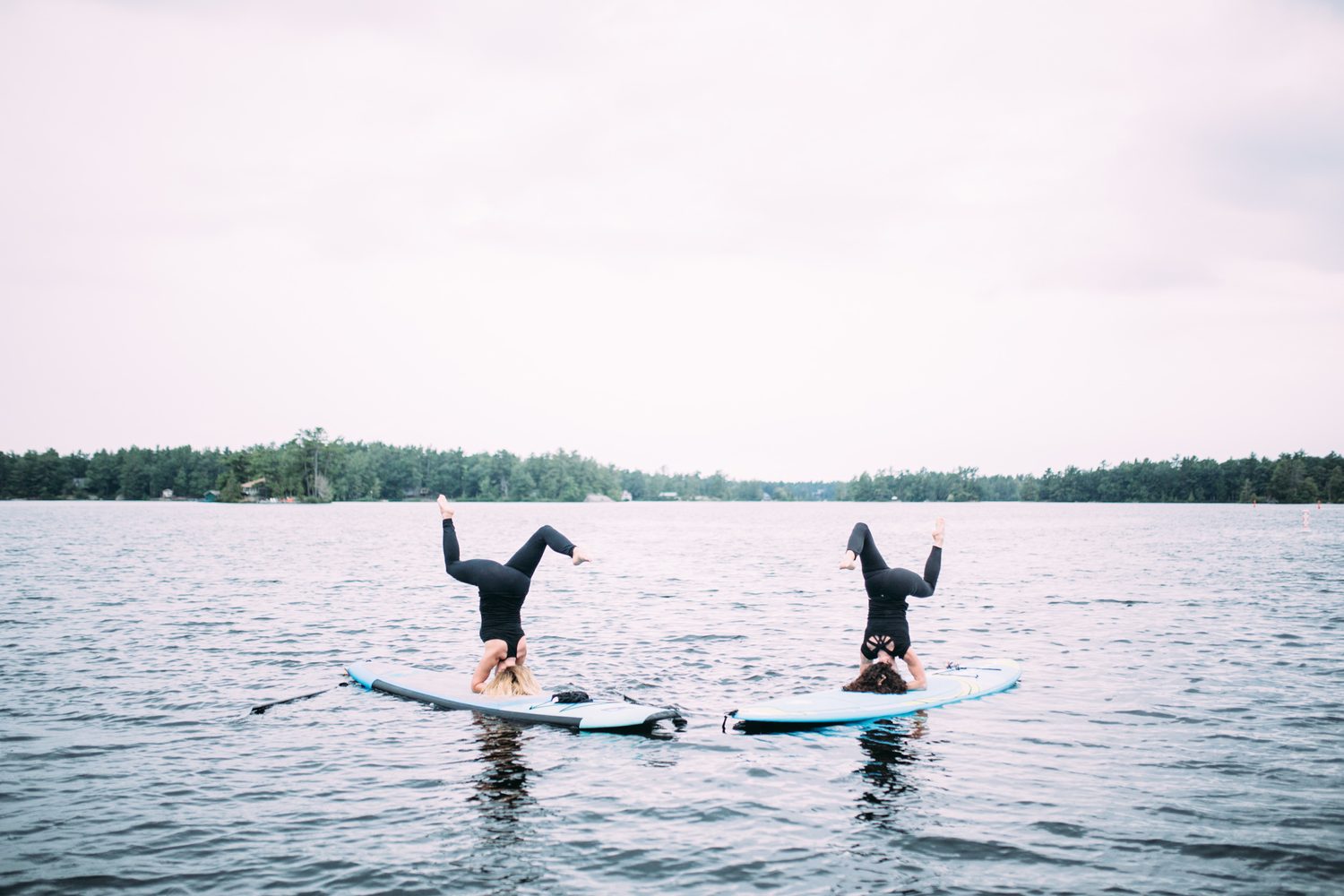 Ash and Jill, SUP Yoga corporate story frame 37: Corporate lifestyle photography for Ash and Jill on stand-up paddleboards, with yoga movement, instructor portraits and lake-based imagery for a wellness business.