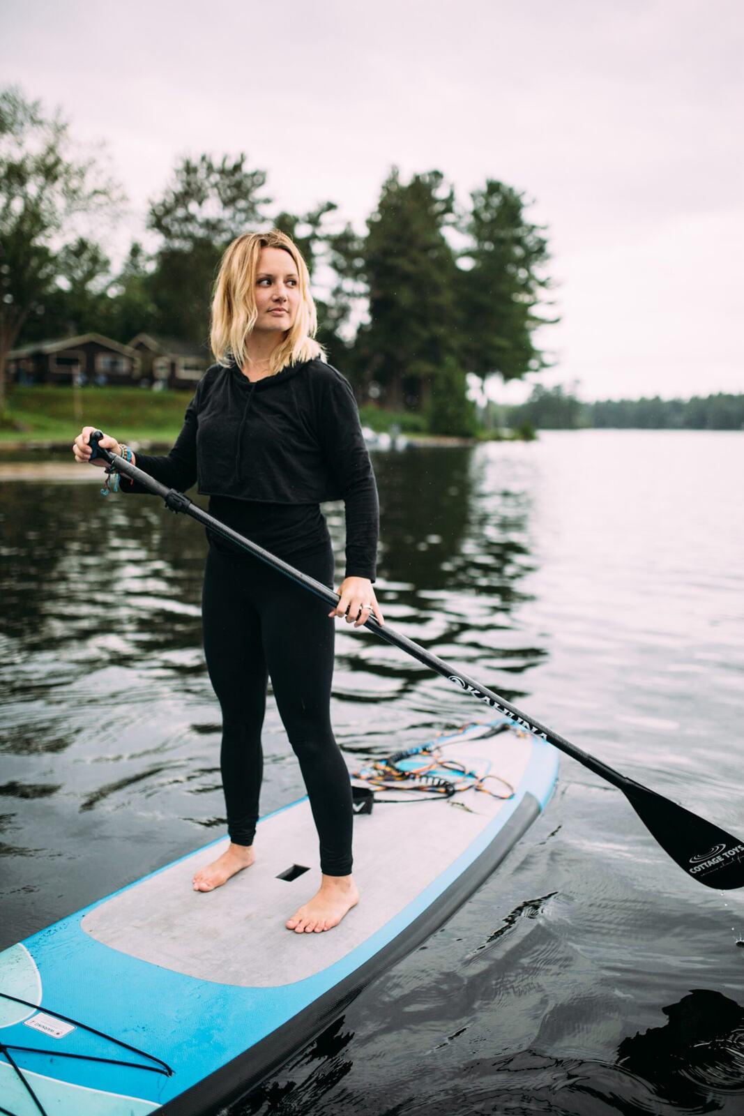 Ash and Jill, SUP Yoga corporate story frame 38: Corporate lifestyle photography for Ash and Jill on stand-up paddleboards, with yoga movement, instructor portraits and lake-based imagery for a wellness business.