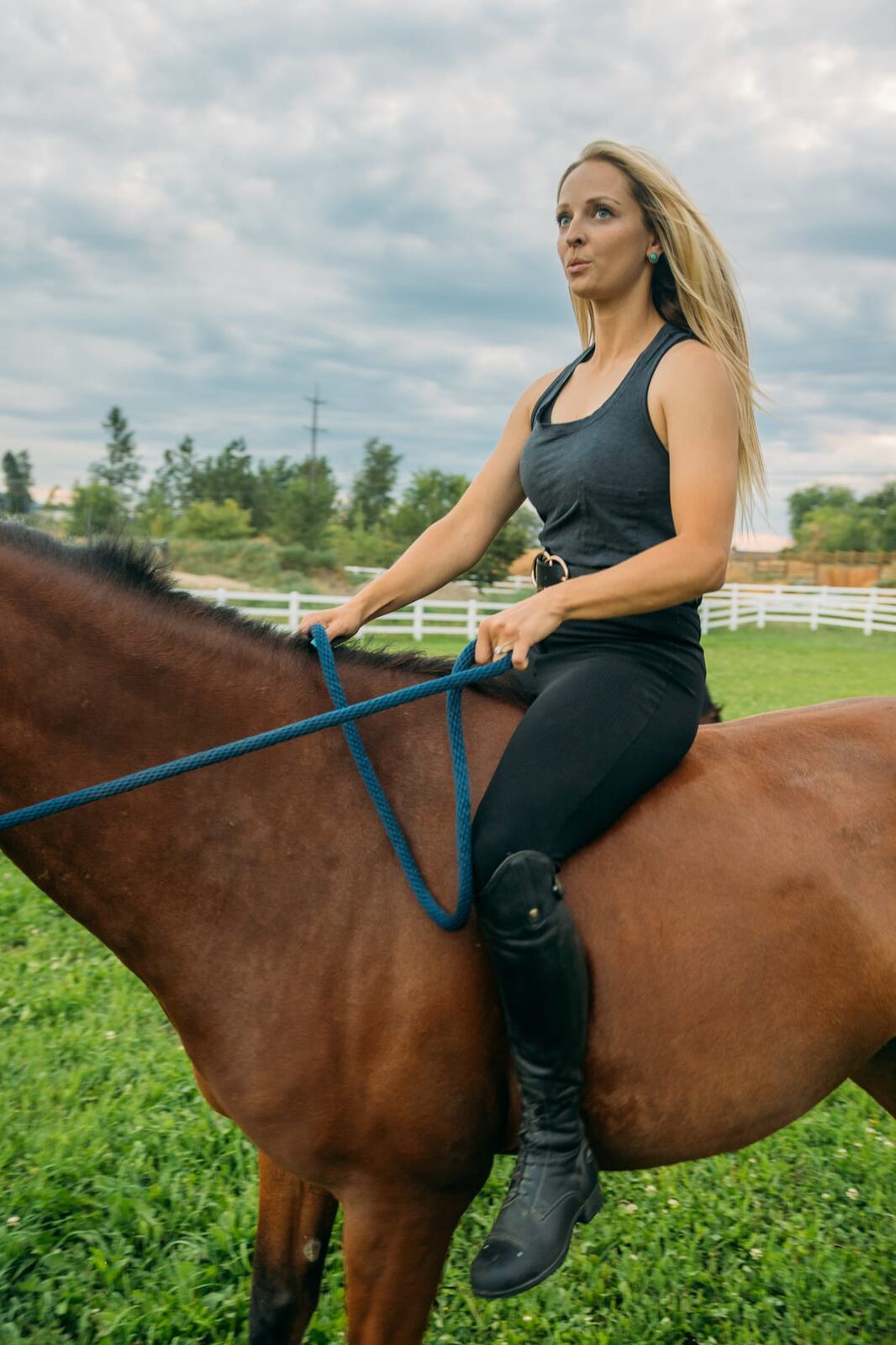 Ashton at the Ranch portraits story frame 6: Ranch portraits for Ashton in Kelowna, with horses, open pasture, quiet country styling and Okanagan light shaped into a grounded portrait story.