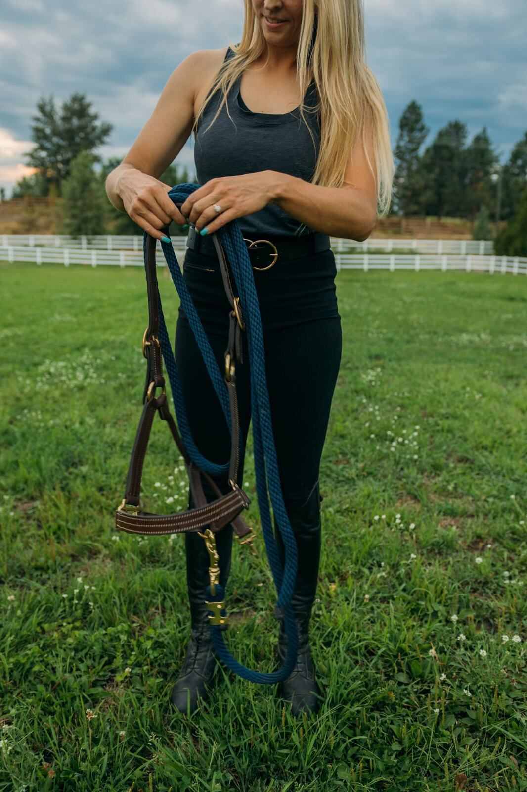 Ashton at the Ranch portraits story frame 9: Ranch portraits for Ashton in Kelowna, with horses, open pasture, quiet country styling and Okanagan light shaped into a grounded portrait story.