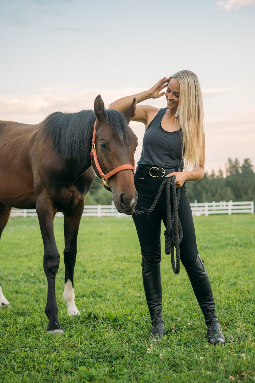 Ashton at the Ranch portraits story frame 1: Ranch portraits for Ashton in Kelowna, with horses, open pasture, quiet country styling and Okanagan light shaped into a grounded portrait story.