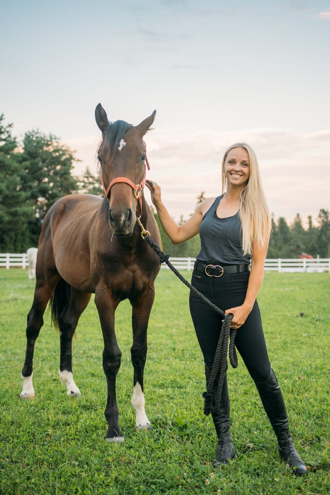 Ashton at the Ranch portraits story frame 2: Ranch portraits for Ashton in Kelowna, with horses, open pasture, quiet country styling and Okanagan light shaped into a grounded portrait story.