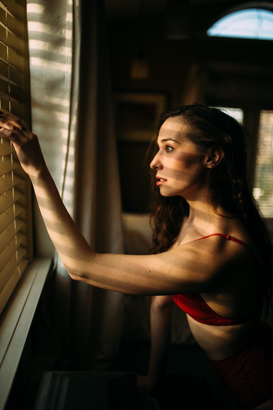 Bailey in Kelowna portraits story frame 13: Two portrait sessions moving through window light, body line, bold colour, foliage and floral-bath portraits.