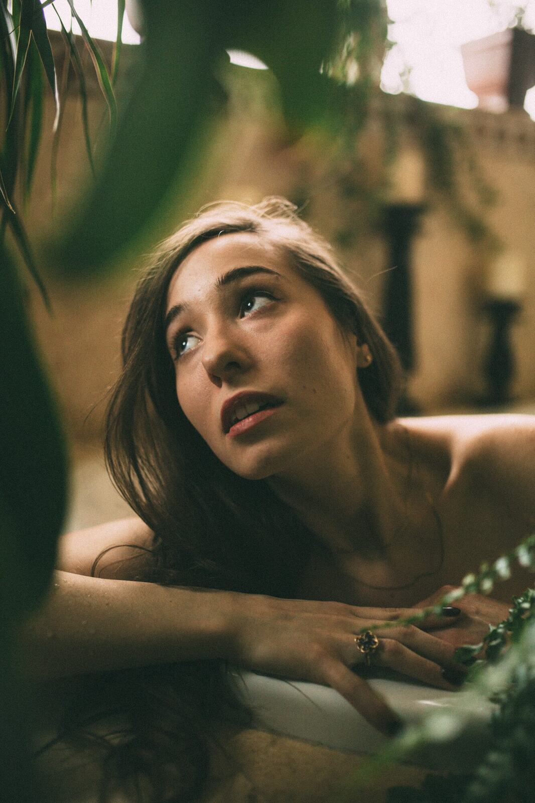 Bailey in Kelowna portraits story frame 33: Two portrait sessions moving through window light, body line, bold colour, foliage and floral-bath portraits.