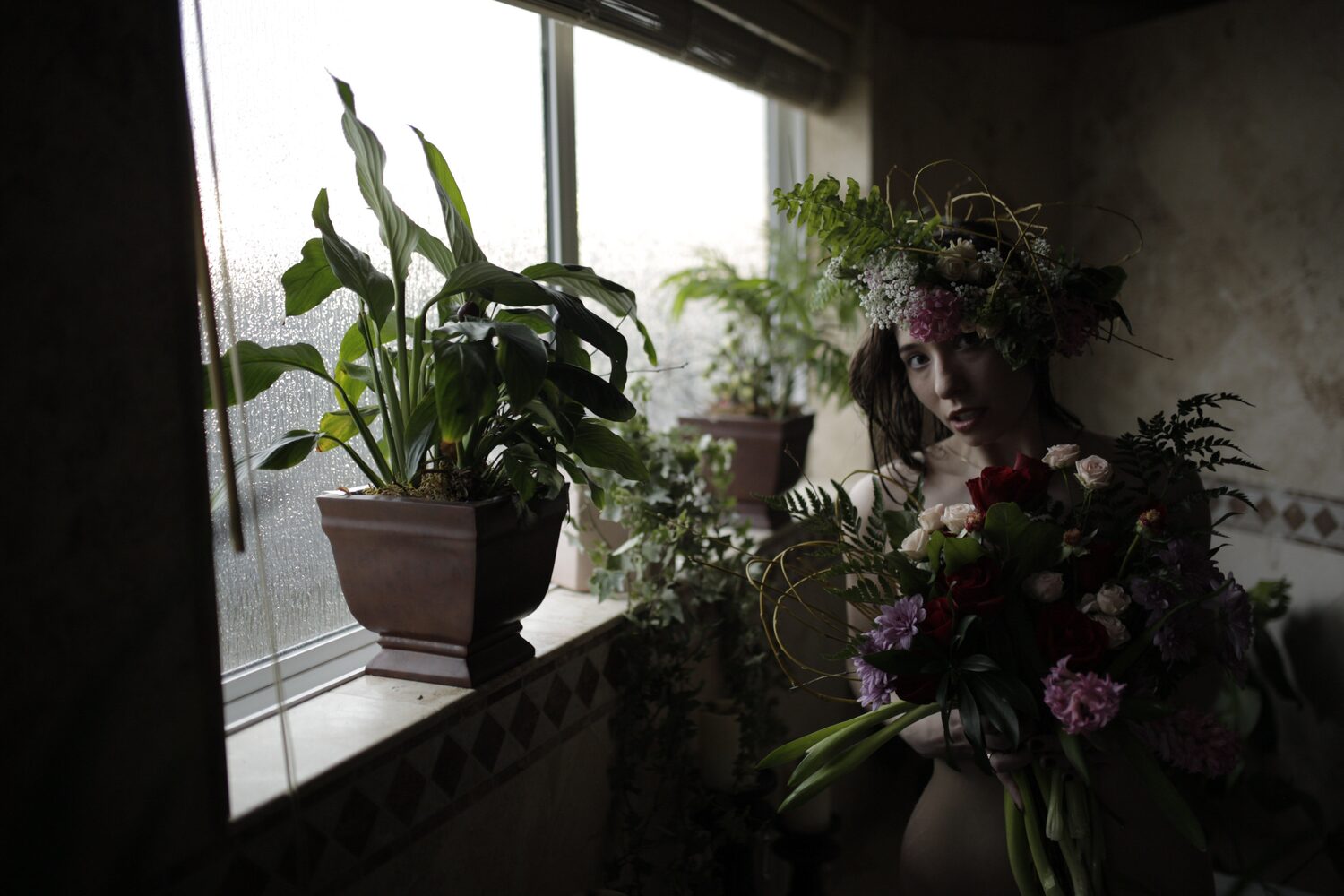 Bailey in Kelowna portraits story frame 36: Two portrait sessions moving through window light, body line, bold colour, foliage and floral-bath portraits.