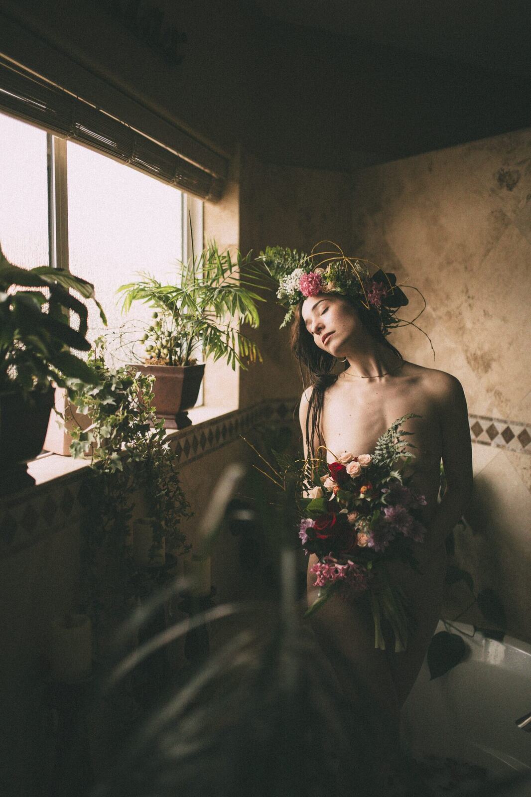 Bailey in Kelowna portraits story frame 39: Two portrait sessions moving through window light, body line, bold colour, foliage and floral-bath portraits.