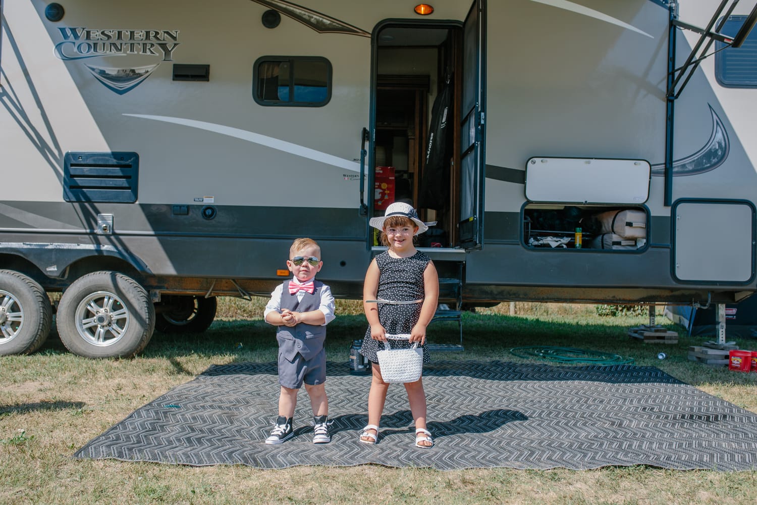 Barbara and Ryan weddings story frame 1: A Salmon Arm wedding near Mount Ida, moving from a private yard to Marine Peace Park and wharf portraits, with the groom's trucking life part of the story..