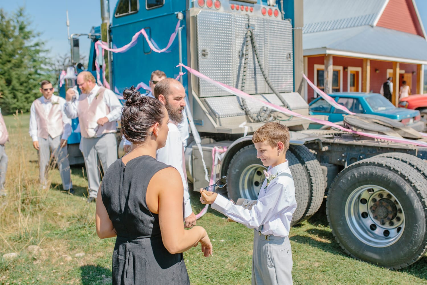 Barbara and Ryan weddings story frame 6: A Salmon Arm wedding near Mount Ida, moving from a private yard to Marine Peace Park and wharf portraits, with the groom's trucking life part of the story..
