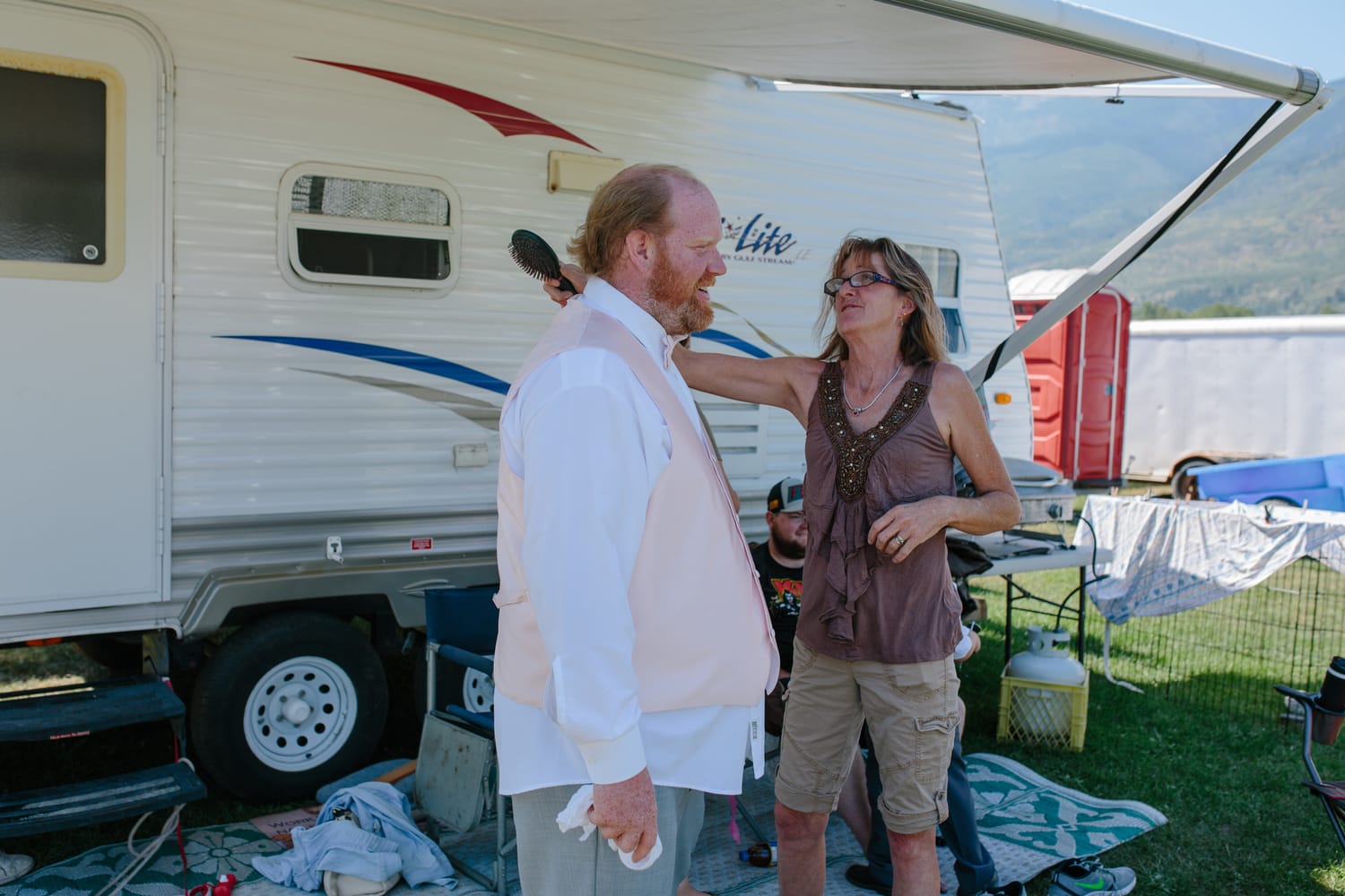 Barbara and Ryan weddings story frame 2: A Salmon Arm wedding near Mount Ida, moving from a private yard to Marine Peace Park and wharf portraits, with the groom's trucking life part of the story..