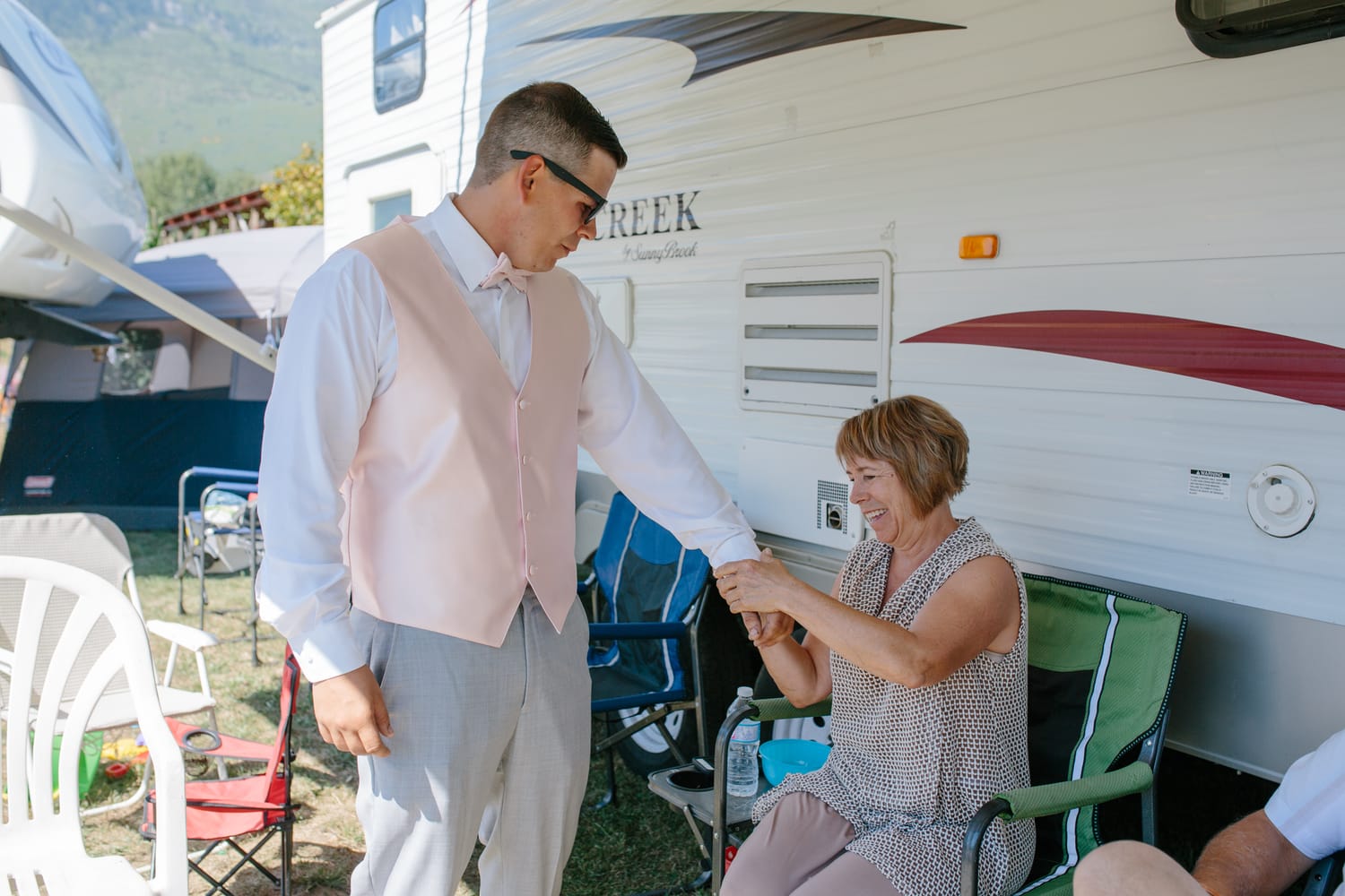 Barbara and Ryan weddings story frame 4: A Salmon Arm wedding near Mount Ida, moving from a private yard to Marine Peace Park and wharf portraits, with the groom's trucking life part of the story..