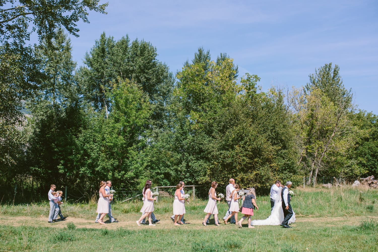 Barbara and Ryan weddings story frame 18: A Salmon Arm wedding near Mount Ida, moving from a private yard to Marine Peace Park and wharf portraits, with the groom's trucking life part of the story..