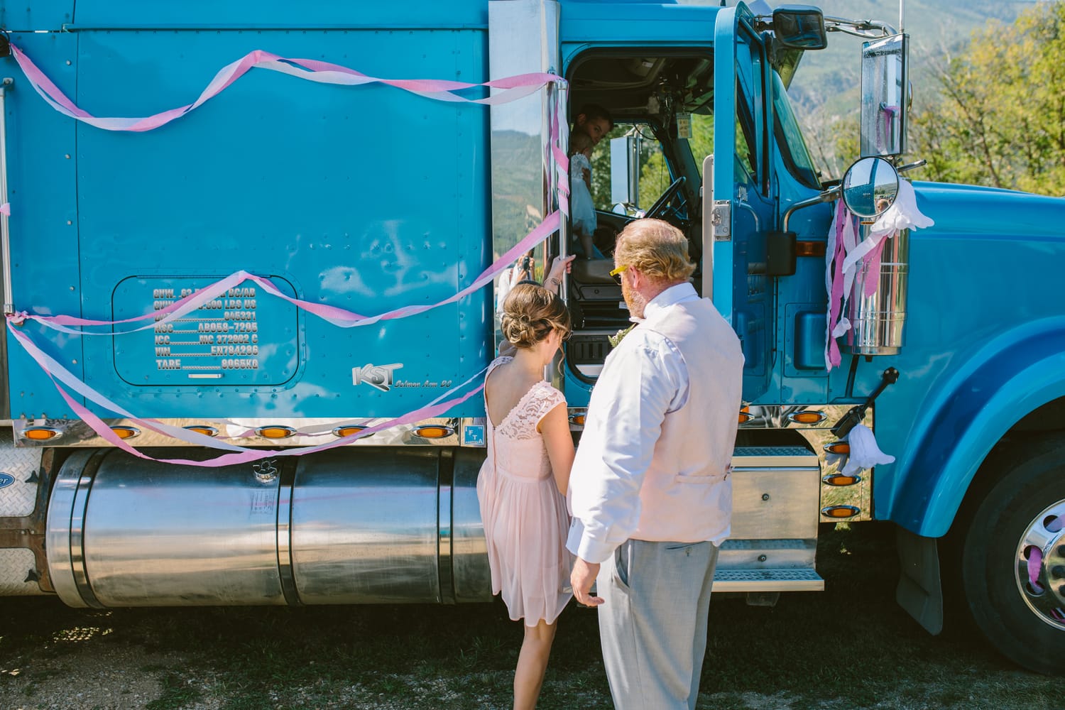 Barbara and Ryan weddings story frame 19: A Salmon Arm wedding near Mount Ida, moving from a private yard to Marine Peace Park and wharf portraits, with the groom's trucking life part of the story..