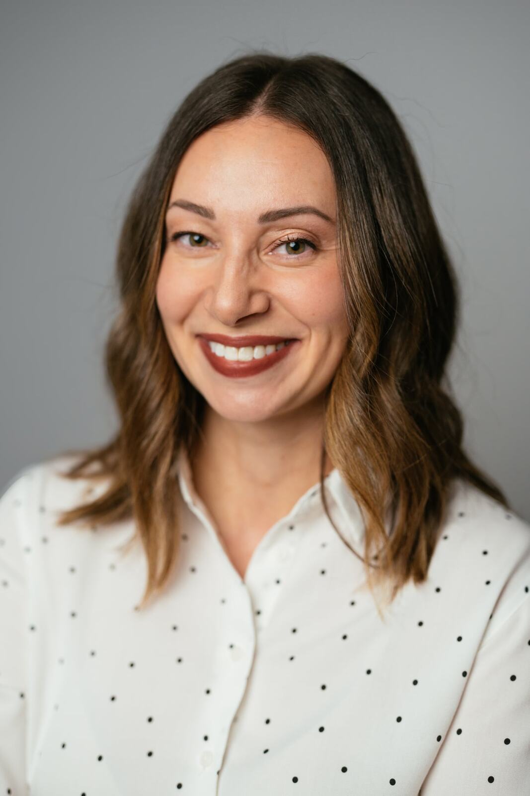 Beth in a tight smiling headshot crop