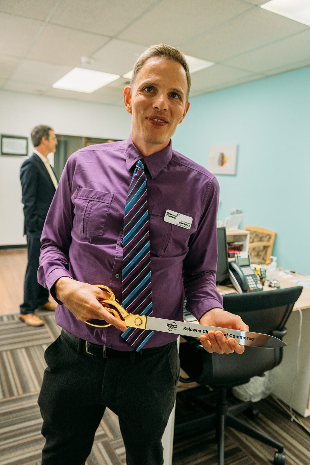 BrainTrust Canada Grand Opening corporate story frame 10: Event photography for BrainTrust Canada's Kelowna grand opening, with ribbon cutting, guests, office details, local food and exterior images for community and nonprofit communications..
