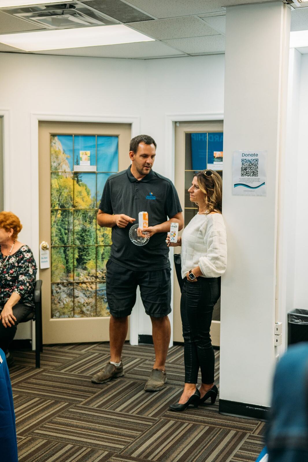 BrainTrust Canada Grand Opening corporate story frame 11: Event photography for BrainTrust Canada's Kelowna grand opening, with ribbon cutting, guests, office details, local food and exterior images for community and nonprofit communications..