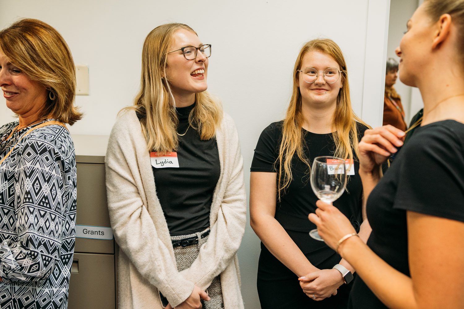 BrainTrust Canada Grand Opening corporate story frame 25: Event photography for BrainTrust Canada's Kelowna grand opening, with ribbon cutting, guests, office details, local food and exterior images for community and nonprofit communications..