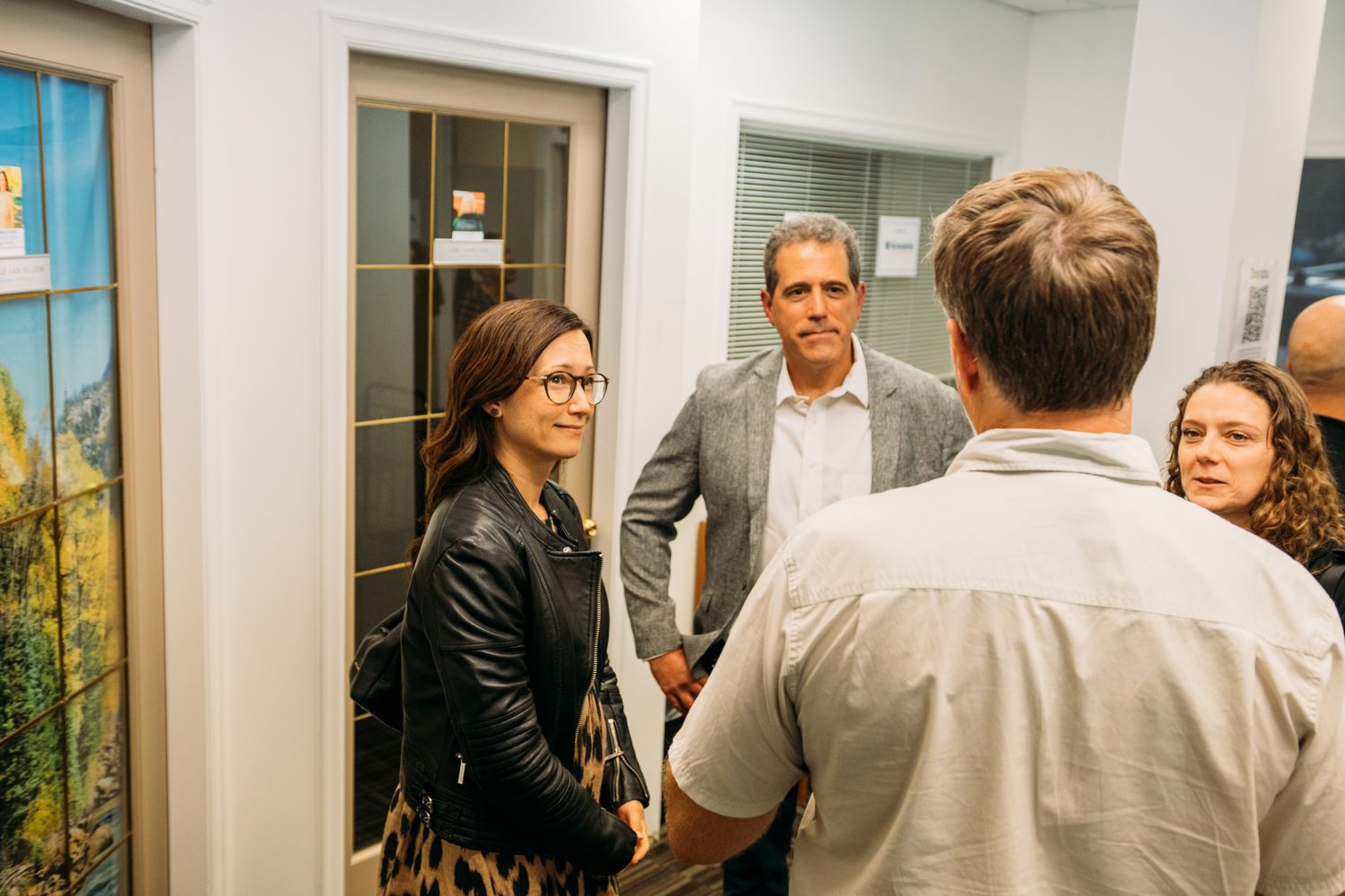 BrainTrust Canada Grand Opening corporate story frame 27: Event photography for BrainTrust Canada's Kelowna grand opening, with ribbon cutting, guests, office details, local food and exterior images for community and nonprofit communications..