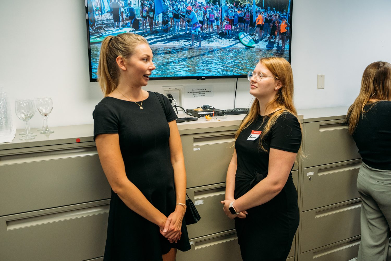 BrainTrust Canada Grand Opening corporate story frame 29: Event photography for BrainTrust Canada's Kelowna grand opening, with ribbon cutting, guests, office details, local food and exterior images for community and nonprofit communications..