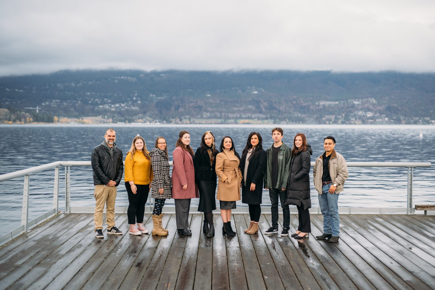 BrainTrust Canada Waterfront corporate story frame 9: Waterfront team and brand portraits for BrainTrust Canada in Kelowna, built around group photos, walking images and approachable nonprofit profile photography..
