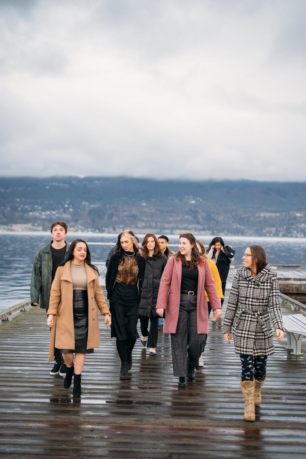 BrainTrust Canada Waterfront corporate story frame 17: Waterfront team and brand portraits for BrainTrust Canada in Kelowna, built around group photos, walking images and approachable nonprofit profile photography..