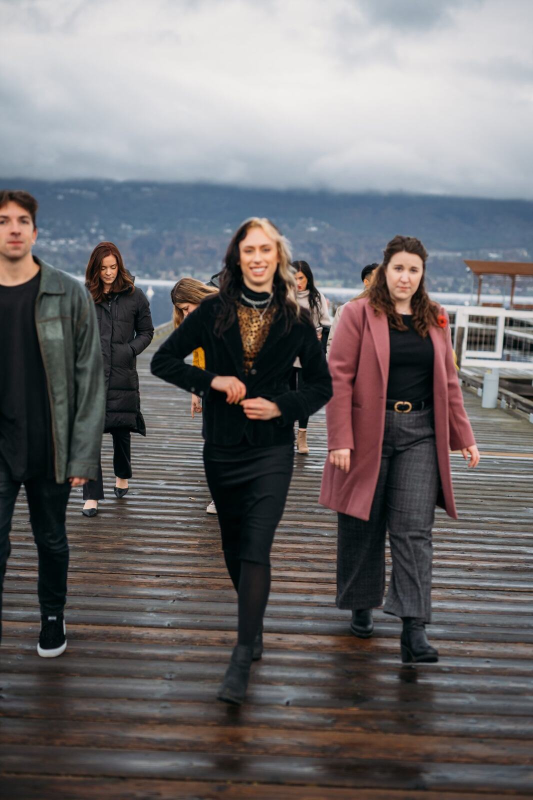 BrainTrust Canada Waterfront corporate story frame 20: Waterfront team and brand portraits for BrainTrust Canada in Kelowna, built around group photos, walking images and approachable nonprofit profile photography..