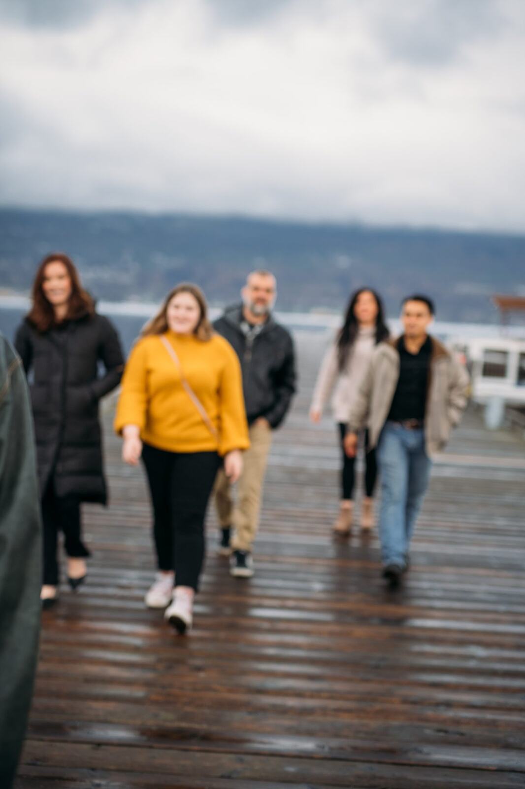 BrainTrust Canada Waterfront corporate story frame 21: Waterfront team and brand portraits for BrainTrust Canada in Kelowna, built around group photos, walking images and approachable nonprofit profile photography..