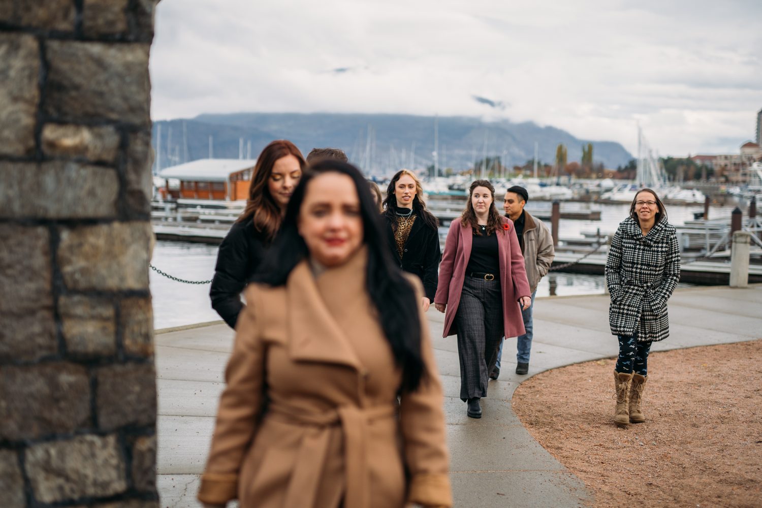 BrainTrust Canada Waterfront corporate story frame 25: Waterfront team and brand portraits for BrainTrust Canada in Kelowna, built around group photos, walking images and approachable nonprofit profile photography..