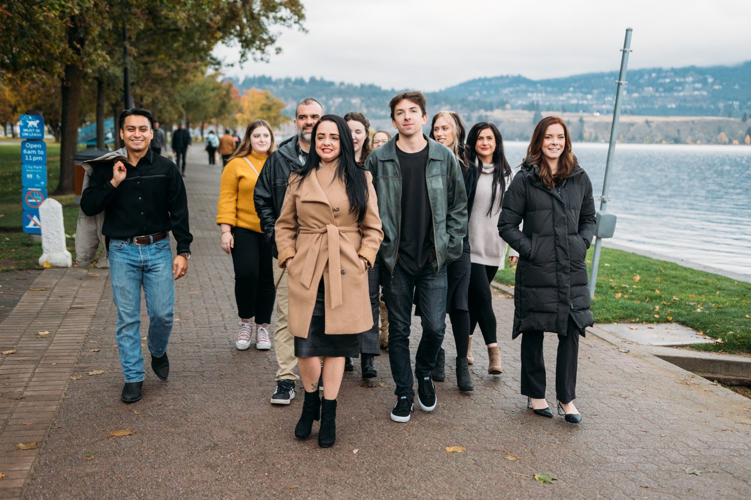 BrainTrust Canada Waterfront corporate story frame 29: Waterfront team and brand portraits for BrainTrust Canada in Kelowna, built around group photos, walking images and approachable nonprofit profile photography..